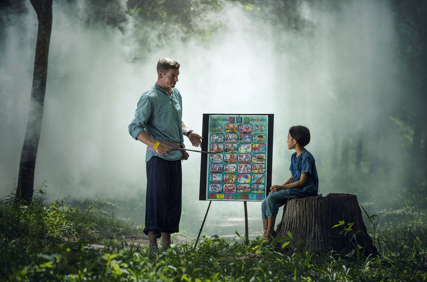 Teacher Teaching Asian Kid